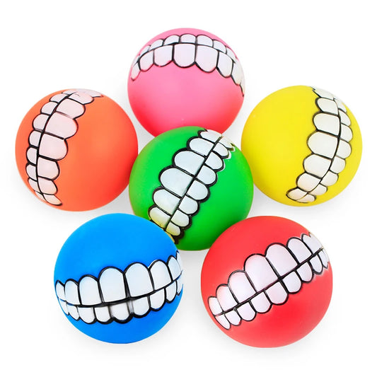 CanineChest squeaky teeth dog toys in various colors, a fun and durable set of chew toys with a smiling teeth effect for playful pets.